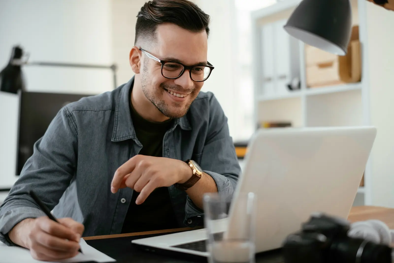 Remote founder reviewing digitized business mail on a laptop, comparing registered agent vs virtual mailbox services