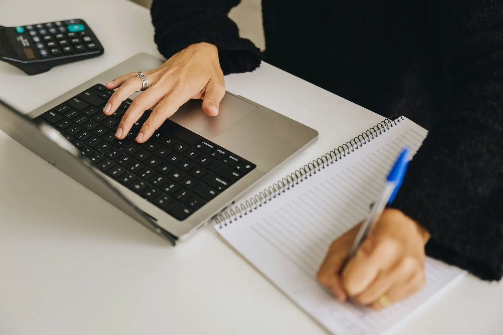 Business owner working at a laptop, managing all business mail in one online dashboard