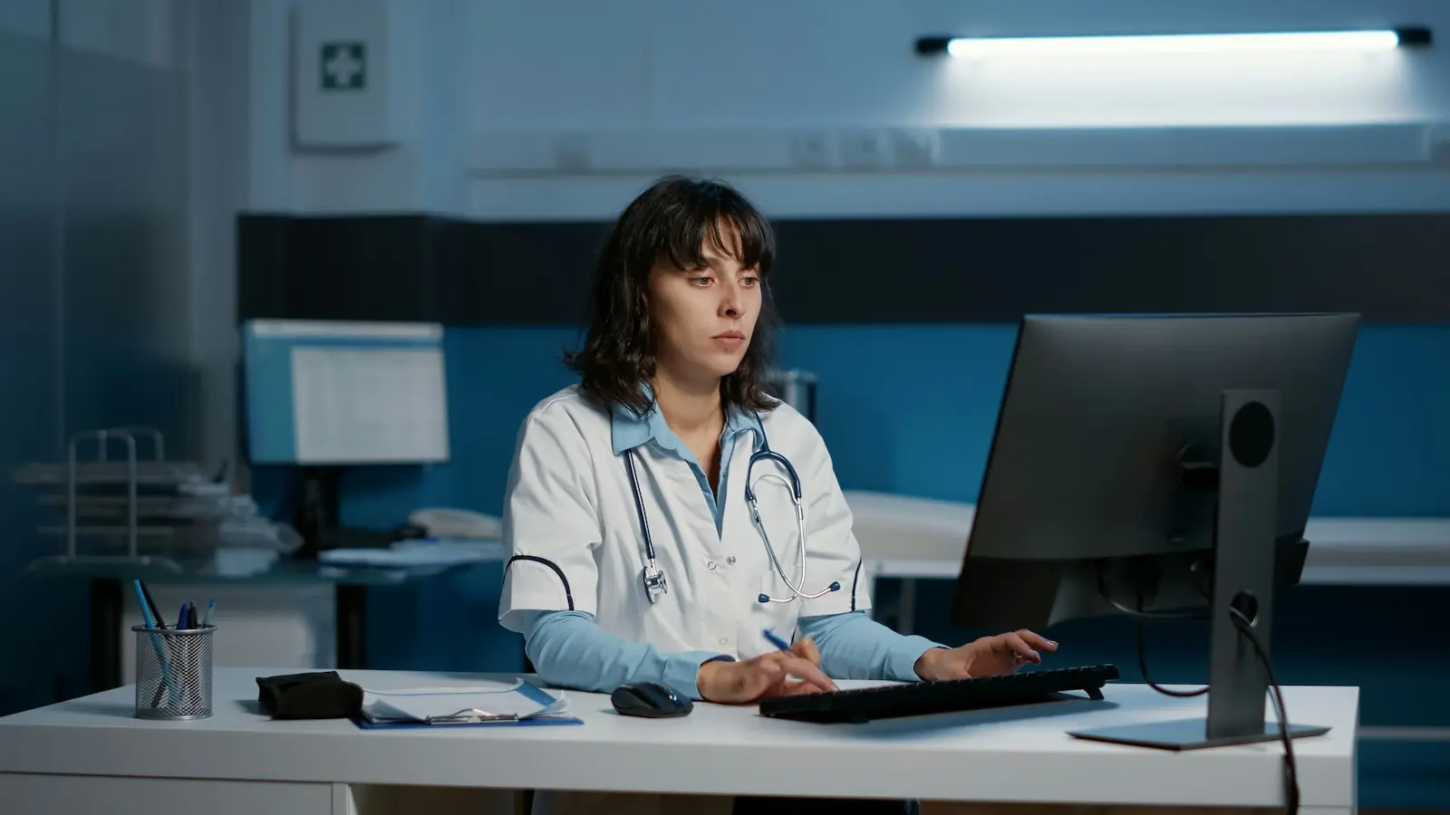 Healthcare provider using a computer to manage HIPAA-compliant patient mail and EHR workflows