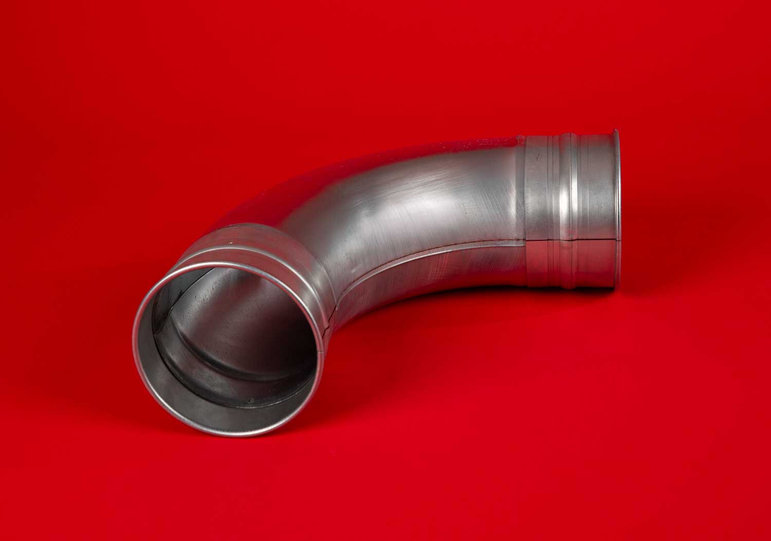 White line drawing of a long radius tubed elbow duct