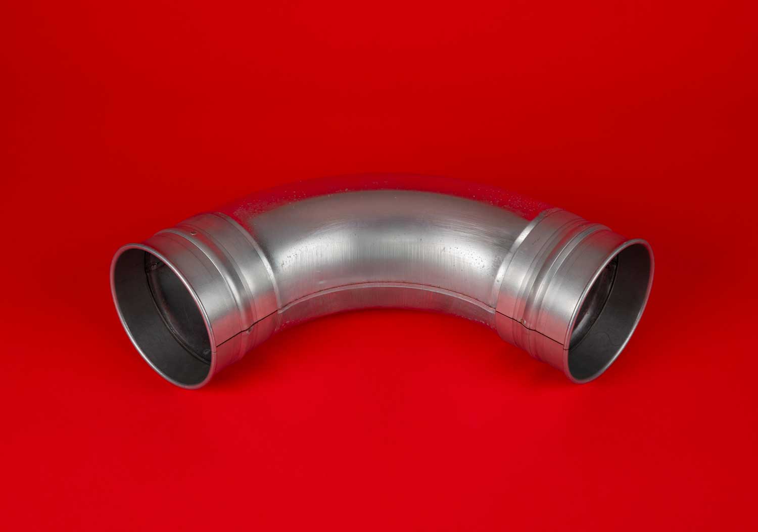 White line drawing of tubed elbow duct