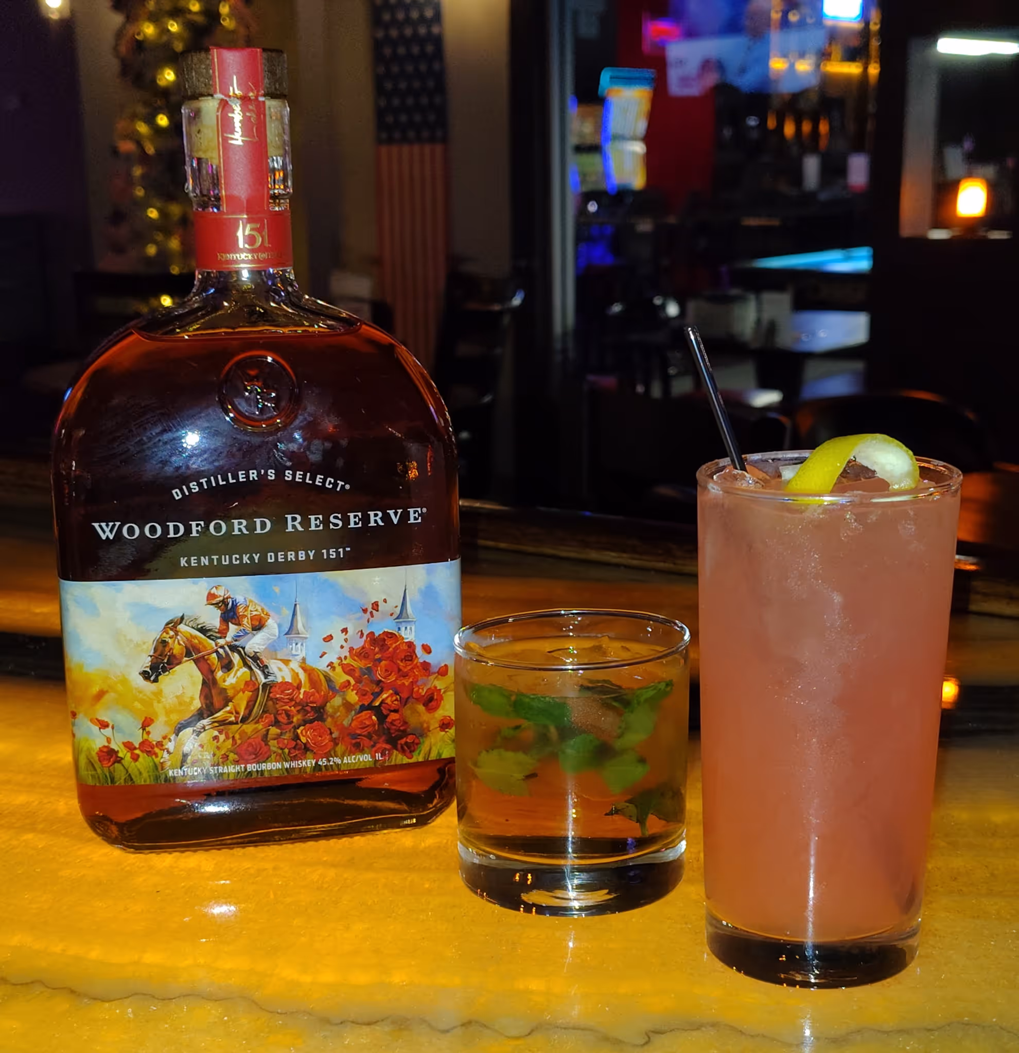 A cocktail and a bottle of liquor