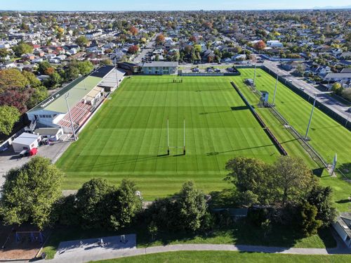 Rugby field looking down the field long ways drone shot in Christchurch New Zealand