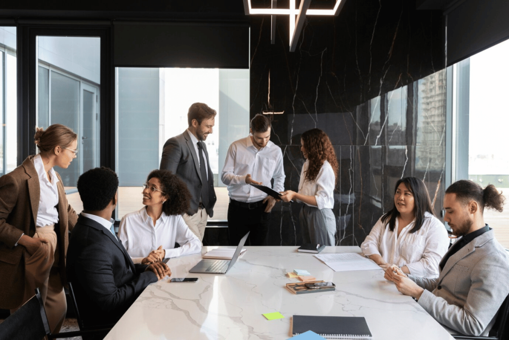 A group of people sitting around a conference table.