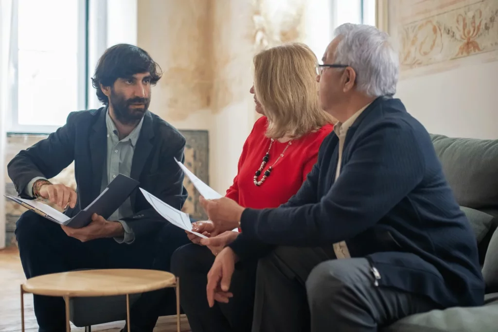 Corporate team in a serious discussion over business plans in a bright room.