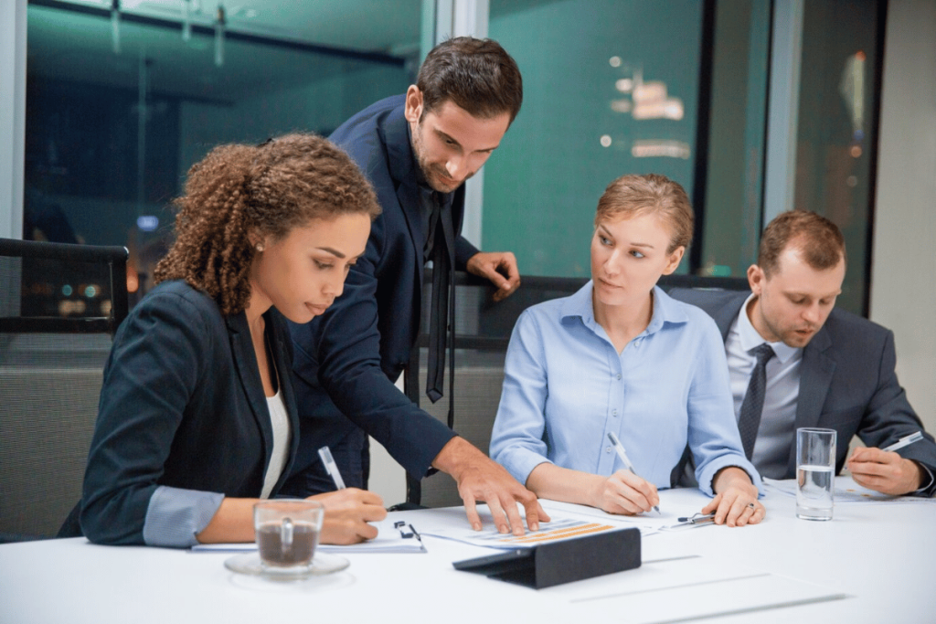 A group of people in a meeting room.