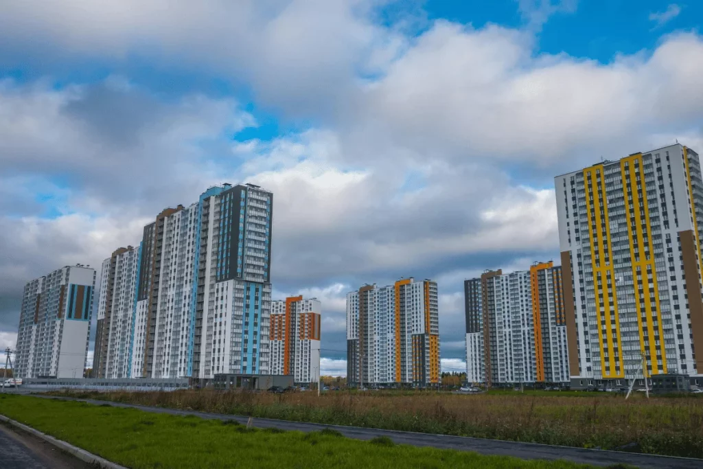 Contemporary cityscape featuring a cluster of colorful high-rise residential buildings.