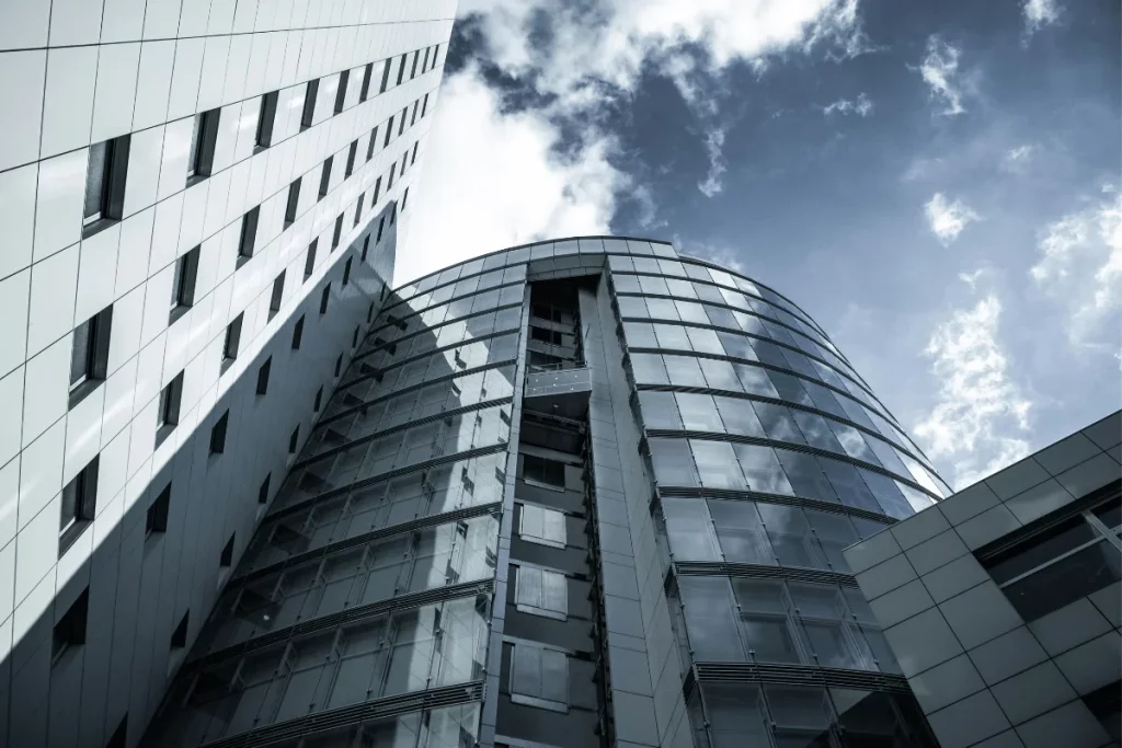 Sleek glass facade of a contemporary business center.