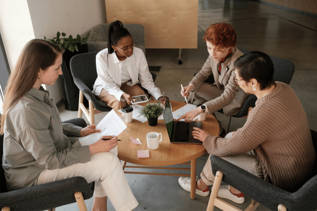 Business meeting with a diverse team in a modern office.