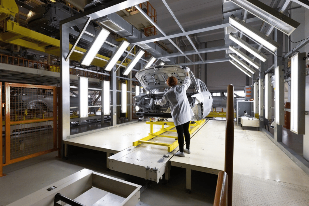 A person working on an assembly line in a factory.
