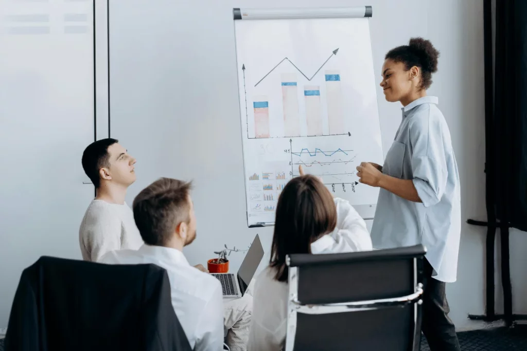 Team attentively listening to financial presentation.