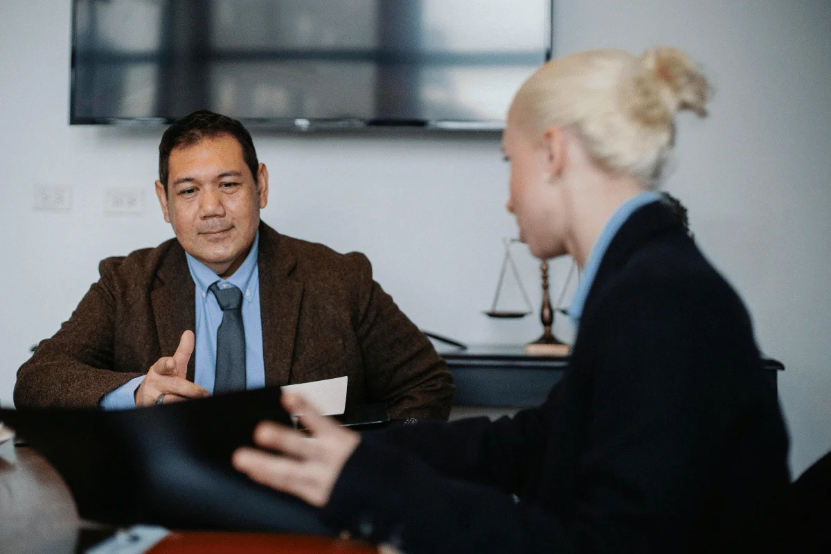 Lawyer consulting with client during legal advice session.