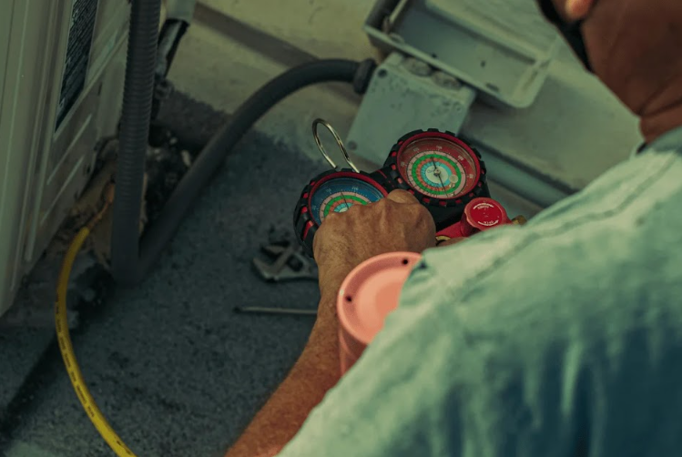 Close-up of HVAC pressure gauges used for air conditioning diagnostics and repair.