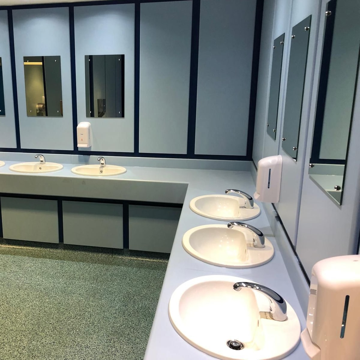 Newly installed basins in a school bathroom