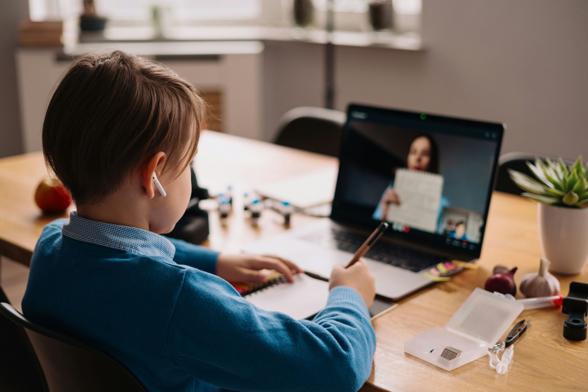 Teacher providing one-on-one instruction to a student in a virtual breakout room during an online tutoring session.