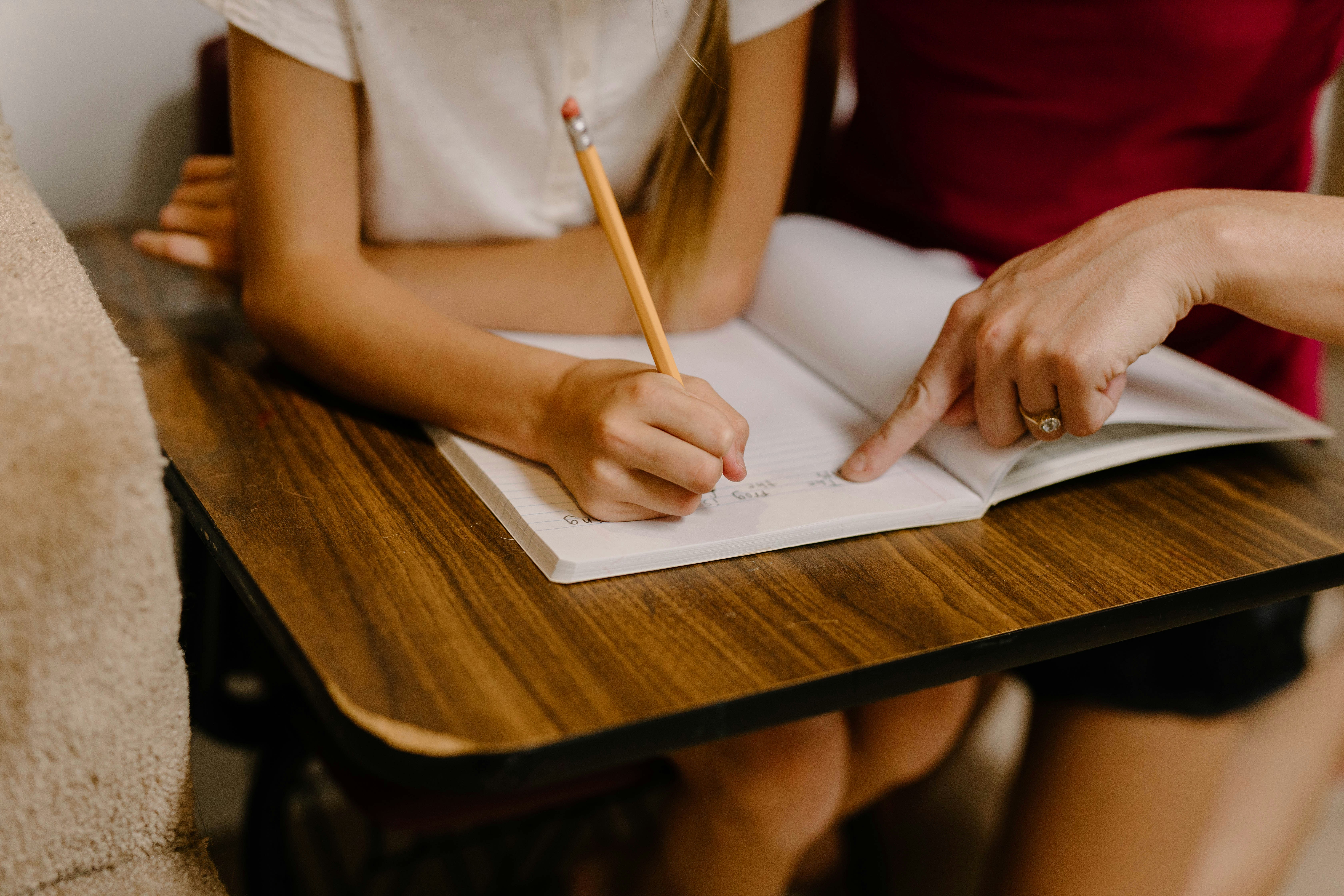 Tutor leading a 1:1 lesson, demonstrating the frequent sessions and focused support of high-dosage tutoring.
