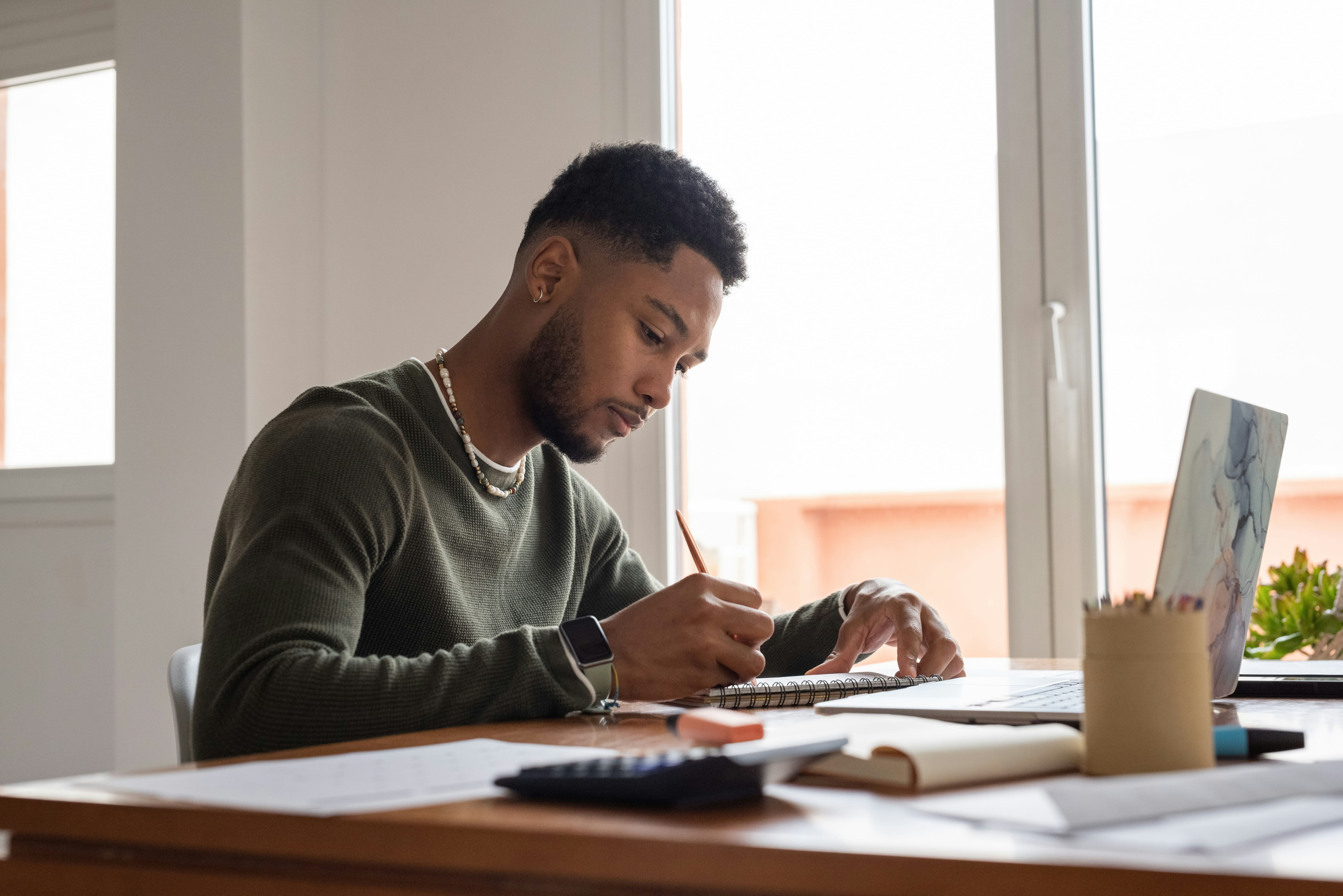 Online tutor tracking student progress by reviewing learning goals, completed work, and academic performance.