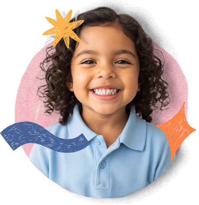 A joyful preschool student with curly hair smiles brightly.