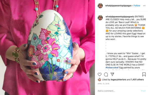 Woman Holding an Egg with Flower paint for Easter Instagram Contests