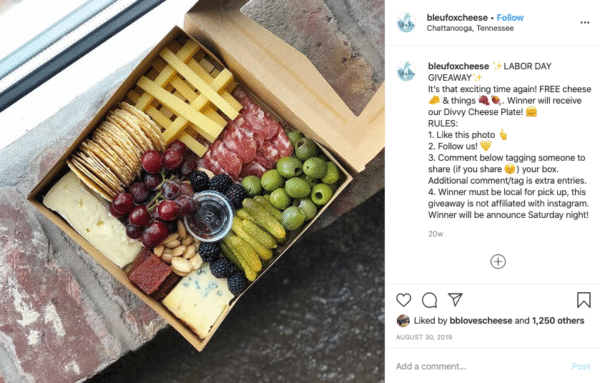 Box of food with cheese, meat, cherry, raspberry, nuts, etc for Labor Day Instagram Contests