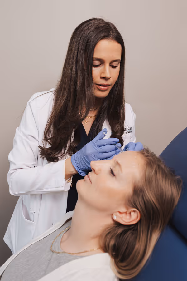 Injector providing a patient with Botox Corte Madera CA next to a portrait of someone smiling at the camera 