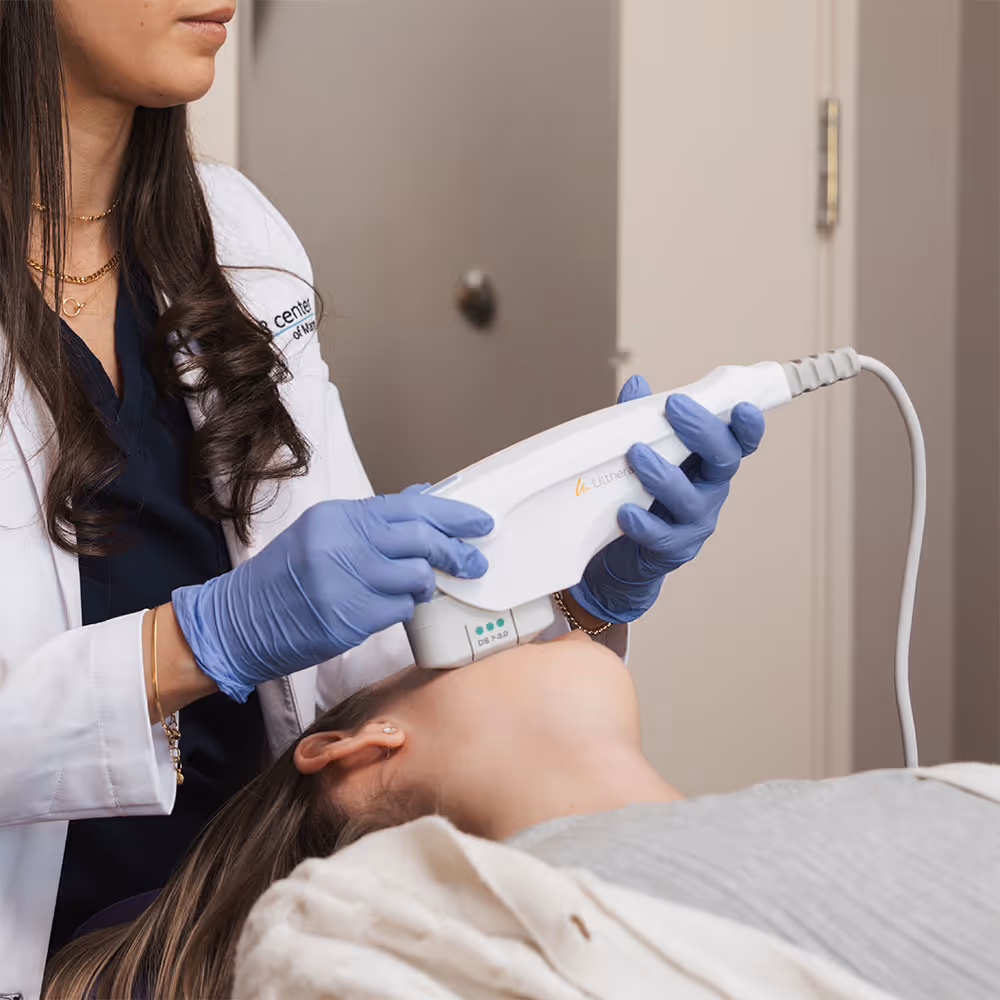 A patient is receiving Ultherapy in Corte Madera, CA, and a provider is holding the ultrasound machine over their face.