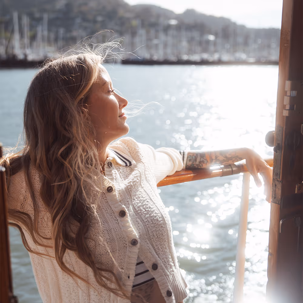 Provider giving a patient IPL Photofacial in Corte Madera, CA, next to an image of a patient smiling in the sun and a gif of a patient wearing eye safety goggles