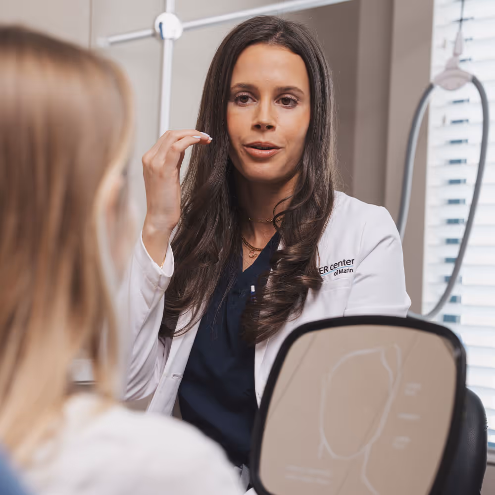 A provider is talking to a patient and explaining the process of getting dermal filler at Laser Center of Marin