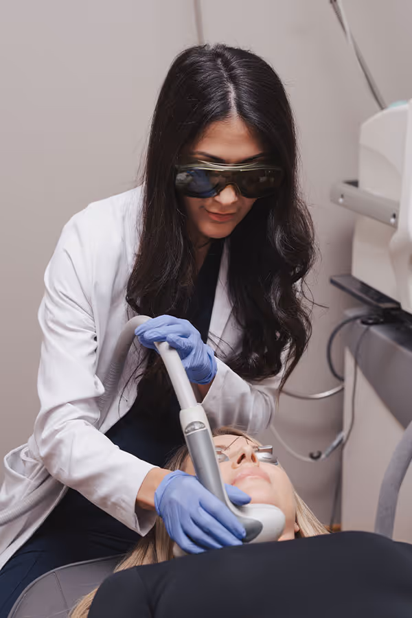 Provider giving a patient IPL Photofacial in Corte Madera, CA, next to an image of a patient smiling in the sun and a gif of a patient wearing eye safety goggles