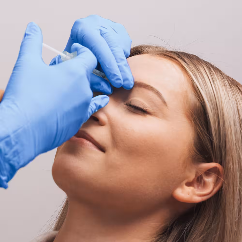Patient receiving Dysport injection for facial rejuvenation, highlighting skin treatment process at Laser Center of Marin.