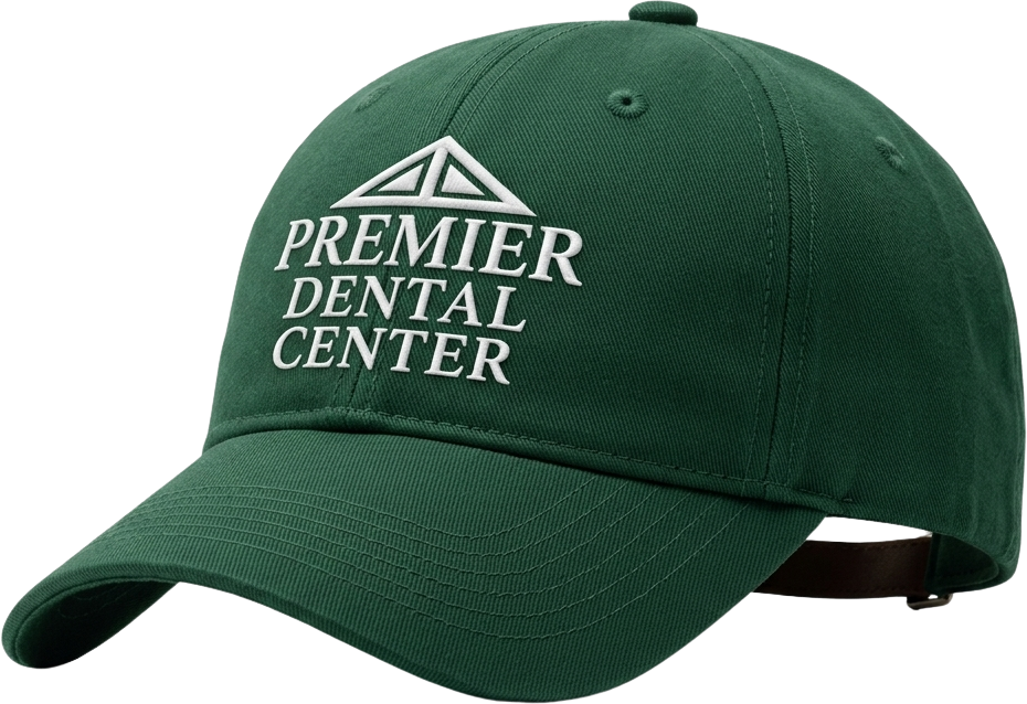 Black fitness tracker, green folded jacket with white earphones, and black massage gun labeled Theragun Prime.