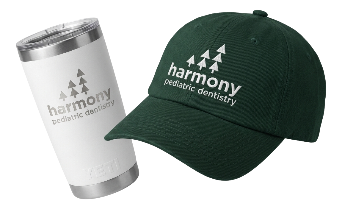 Black fitness tracker, green folded jacket with white earphones, and black massage gun labeled Theragun Prime.