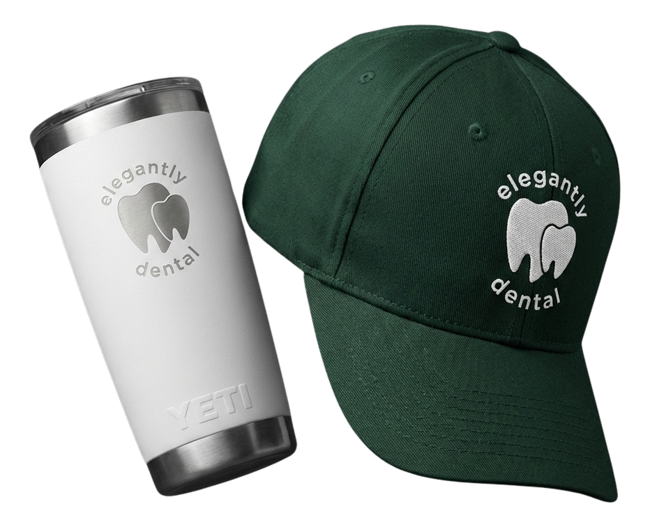 Black fitness tracker, green folded jacket with white earphones, and black massage gun labeled Theragun Prime.