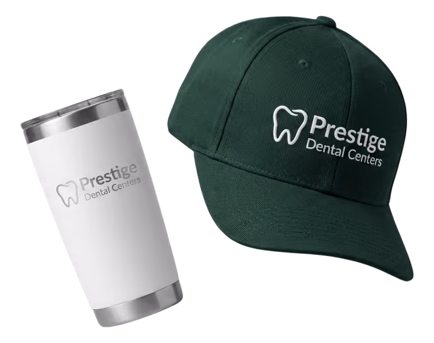 Black fitness tracker, green folded jacket with white earphones, and black massage gun labeled Theragun Prime.