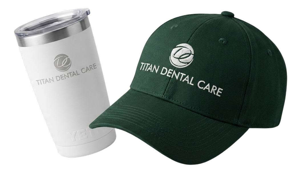 Black fitness tracker, green folded jacket with white earphones, and black massage gun labeled Theragun Prime.