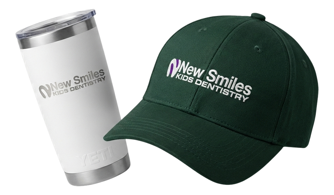 Black fitness tracker, green folded jacket with white earphones, and black massage gun labeled Theragun Prime.