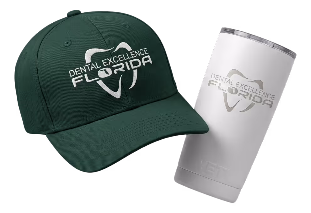 Black fitness tracker, green folded jacket with white earphones, and black massage gun labeled Theragun Prime.