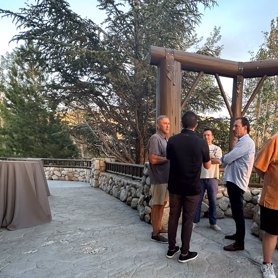 Leadership talking at an event at Lake Tahoe