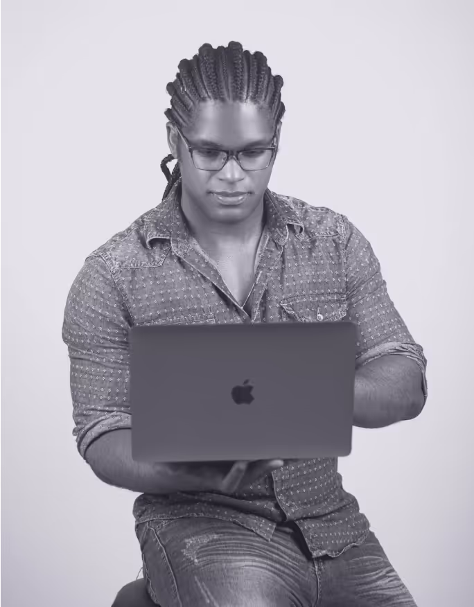 a man holding a laptop