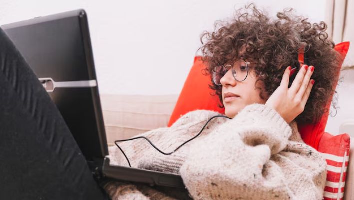 ADHD-friendly desk setup with noise-canceling headphones and room to move