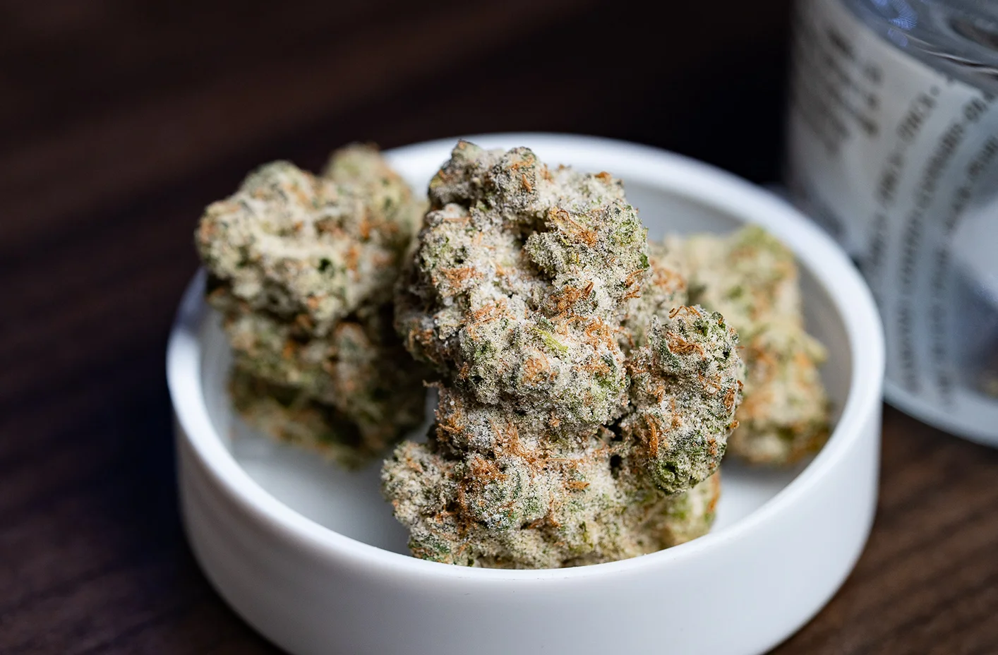 Frosty cannabis flower nug placed on a 3.5grams jar top.