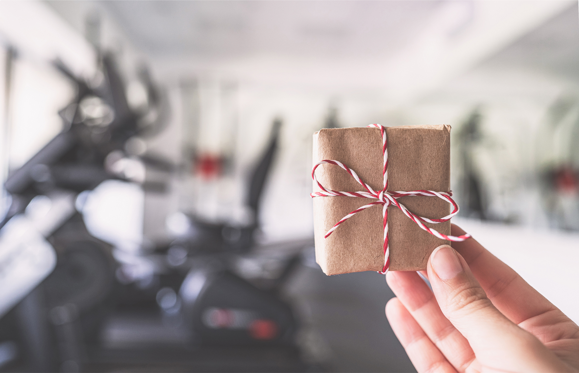 Gym member checking in with mobile phone