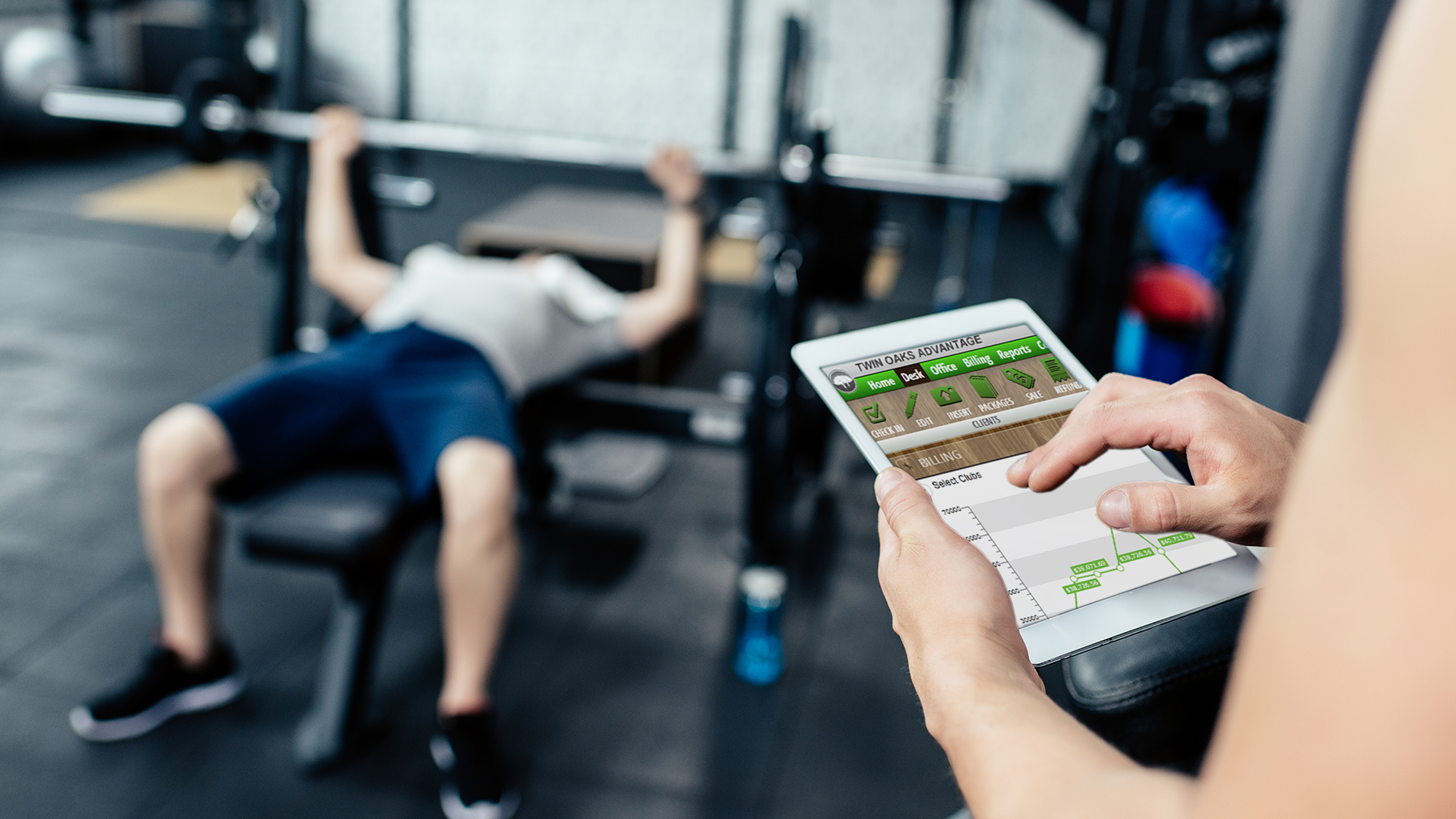 Gym members chatting around gym equipment