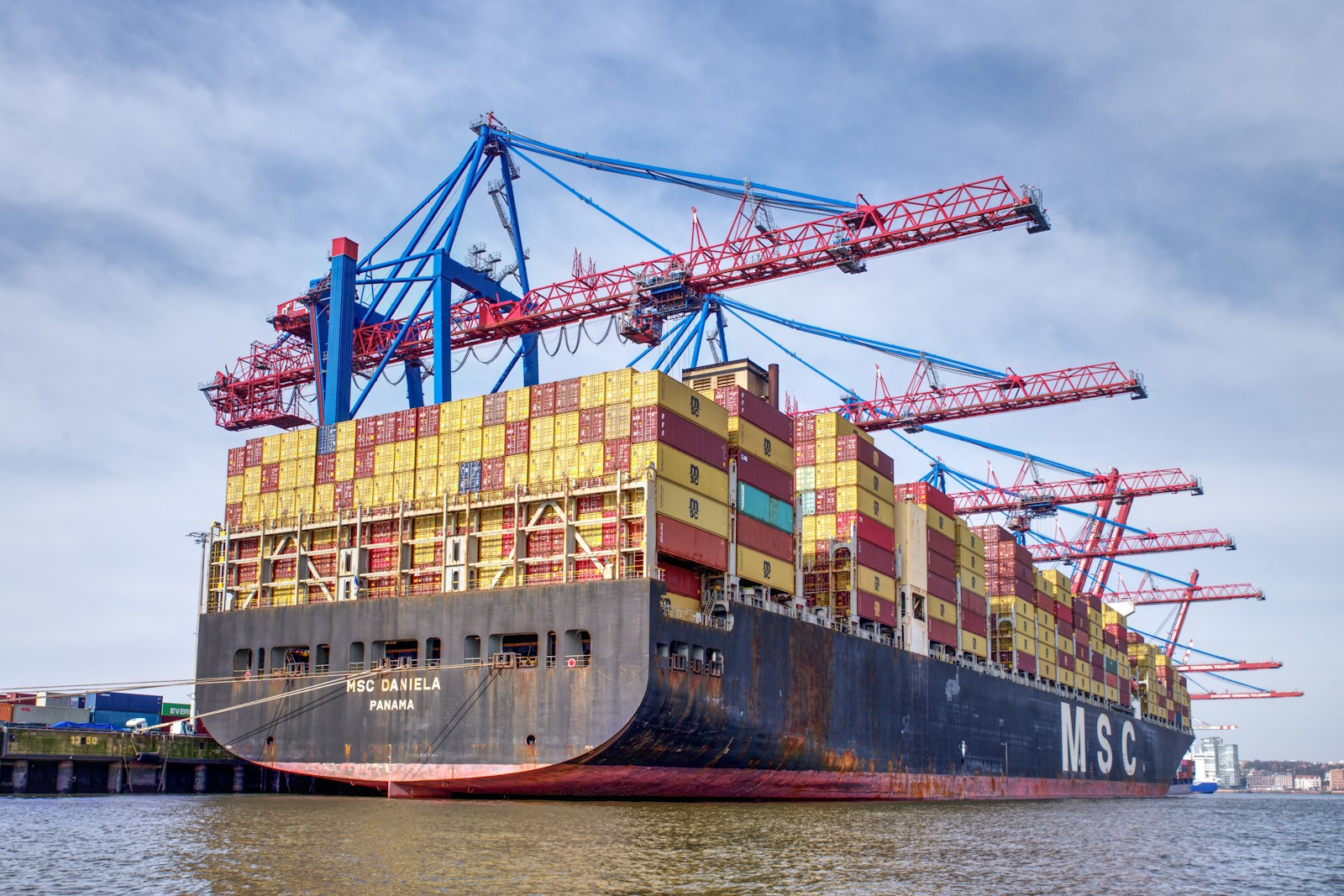 Cargo ship loaded with shipping containers, illustrating post-tariff sourcing decisions