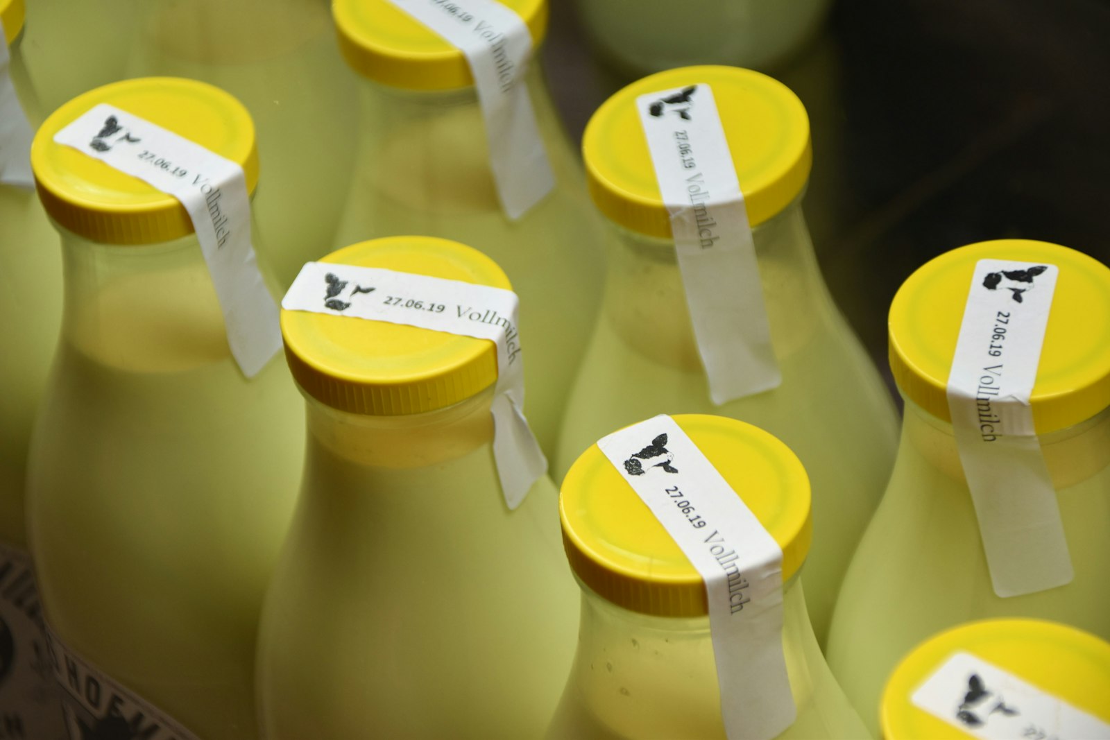 Bottles with caps sealed with tamper-evident tape