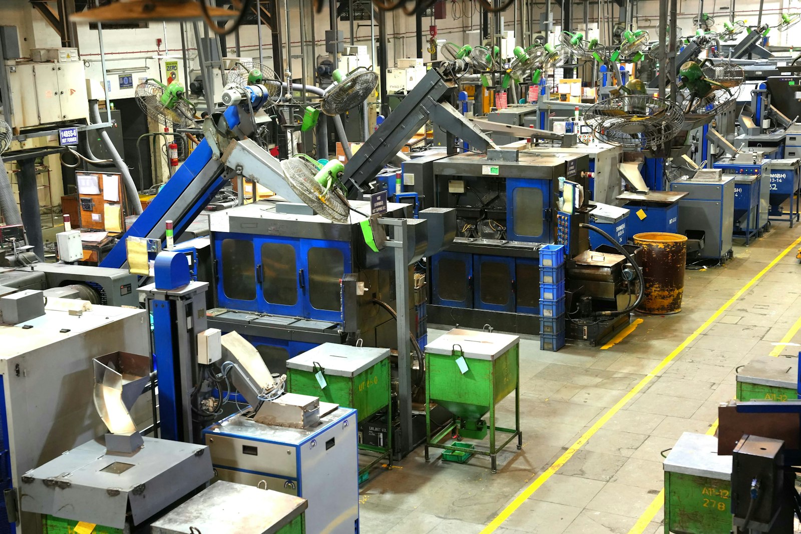 Industrial factory floor with machinery and yellow lines