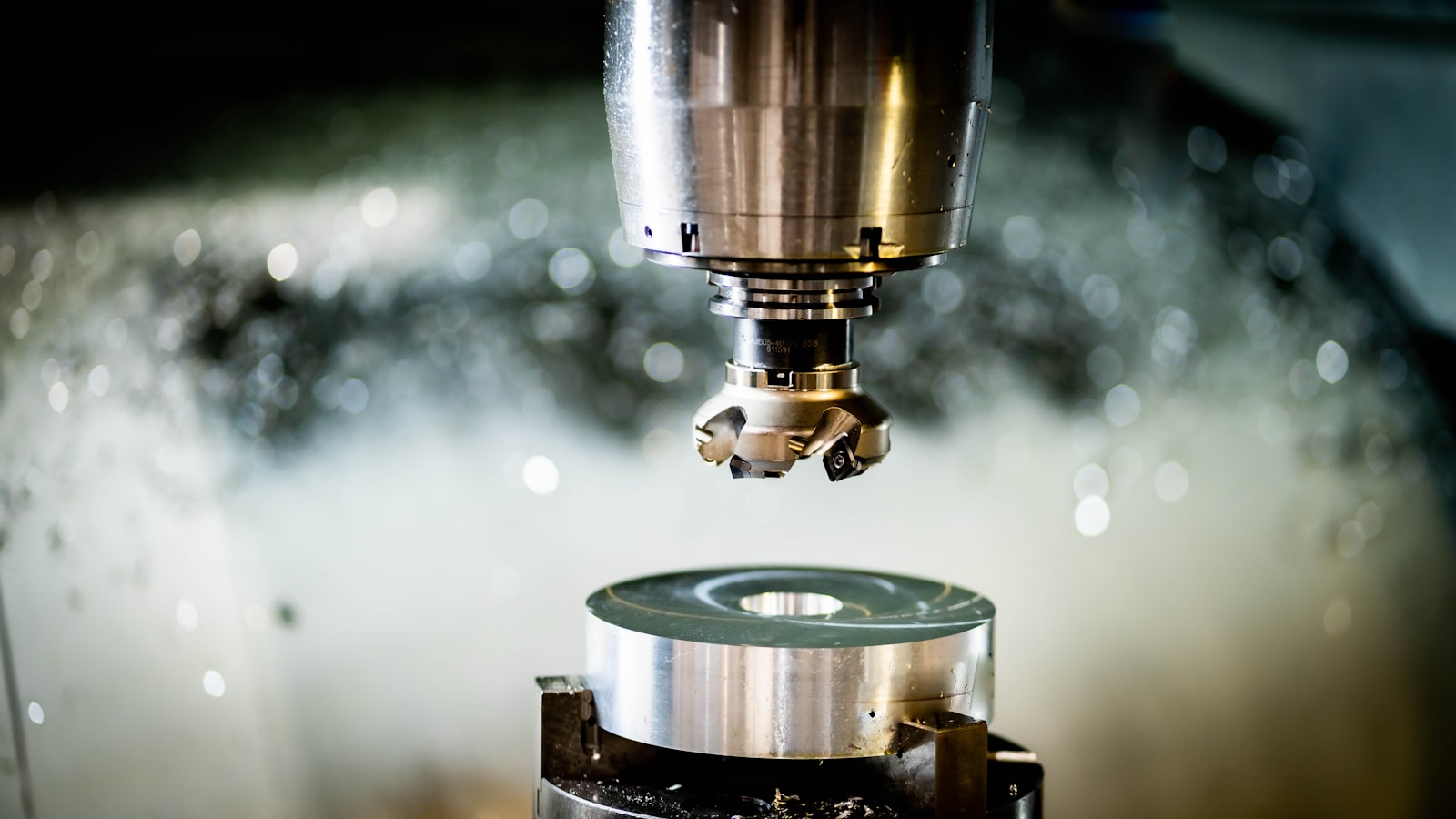 CNC machine cutting a metal tooling component