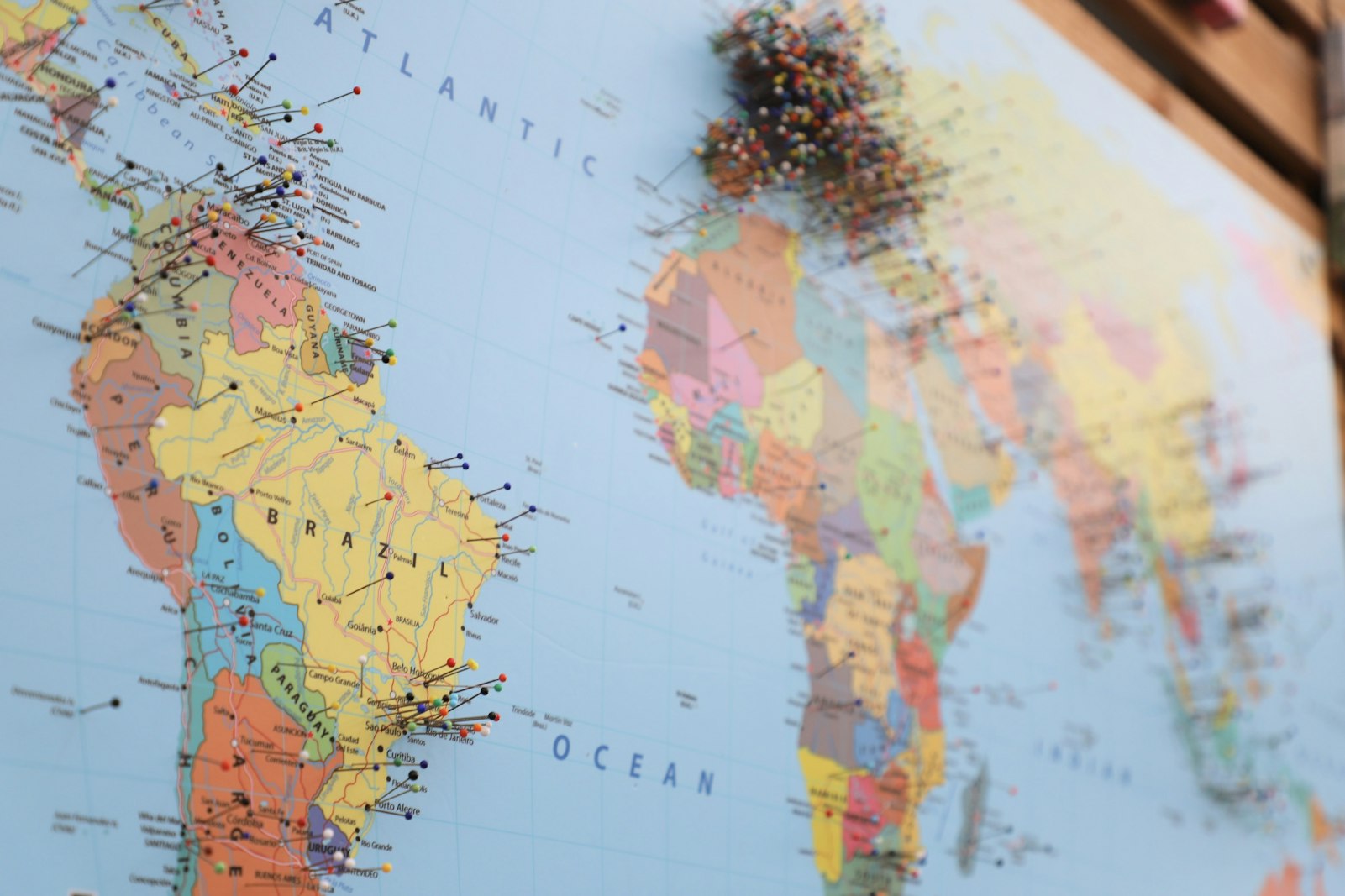 A map of the world with pins on it
