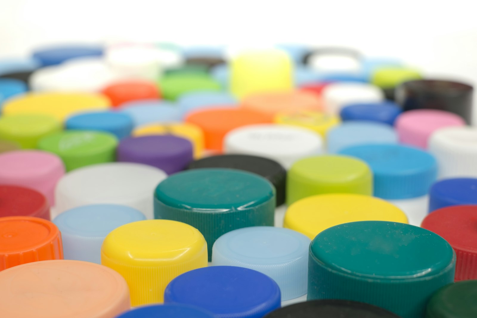 Assortment of colored plastic bottle caps and closures