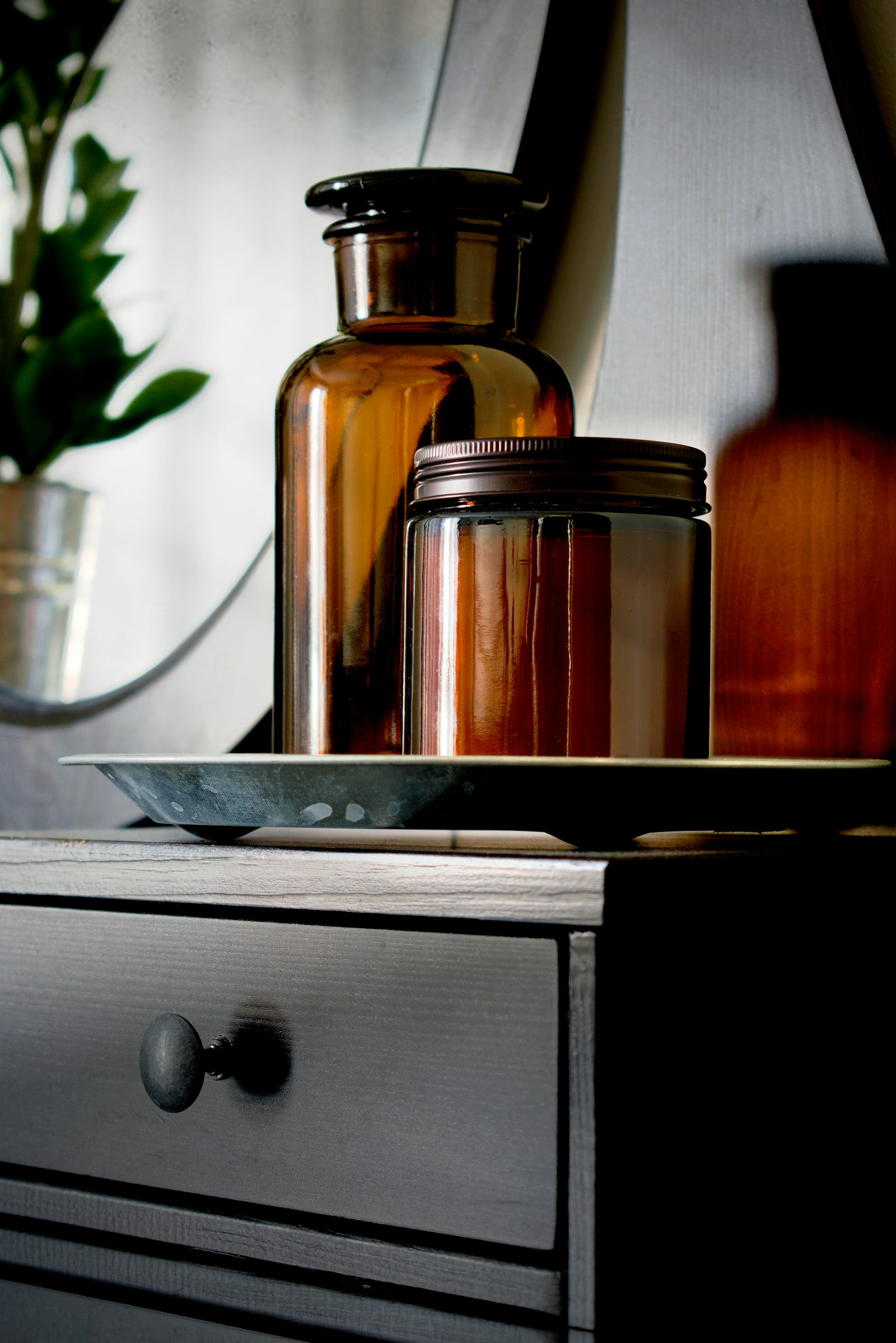 Table topped with amber cosmetic jars and bottles